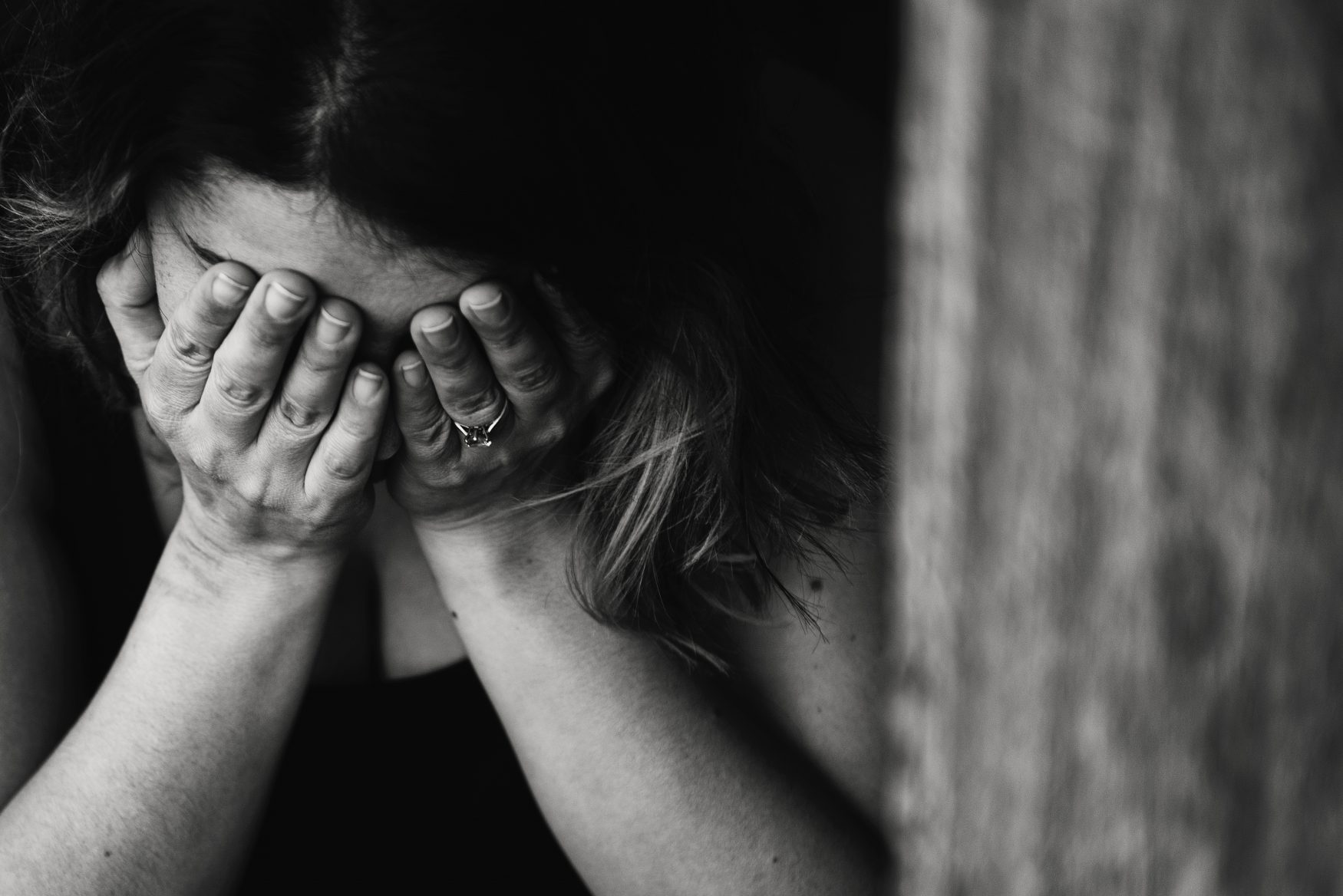 a woman with her head in her hands