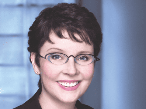 photo of young woman wearing glasses