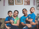 Roma family of four on couch