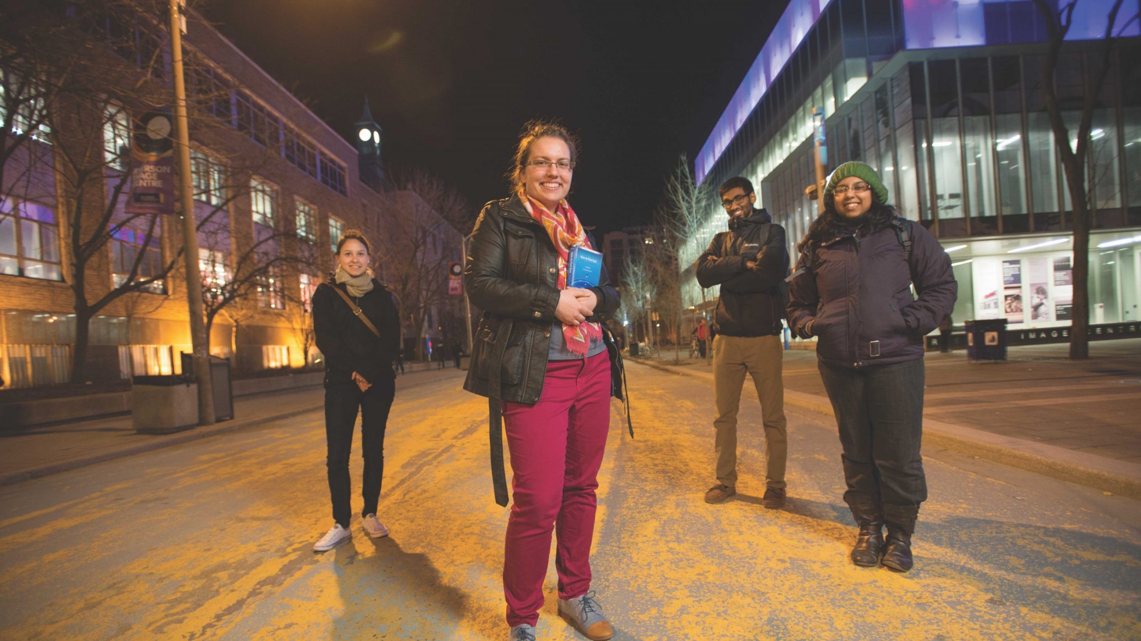 Young adults on street at night