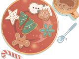 illustration shows Christmas cookies on plate next to candy cane and hot chocolate