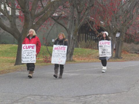 three women on picket line