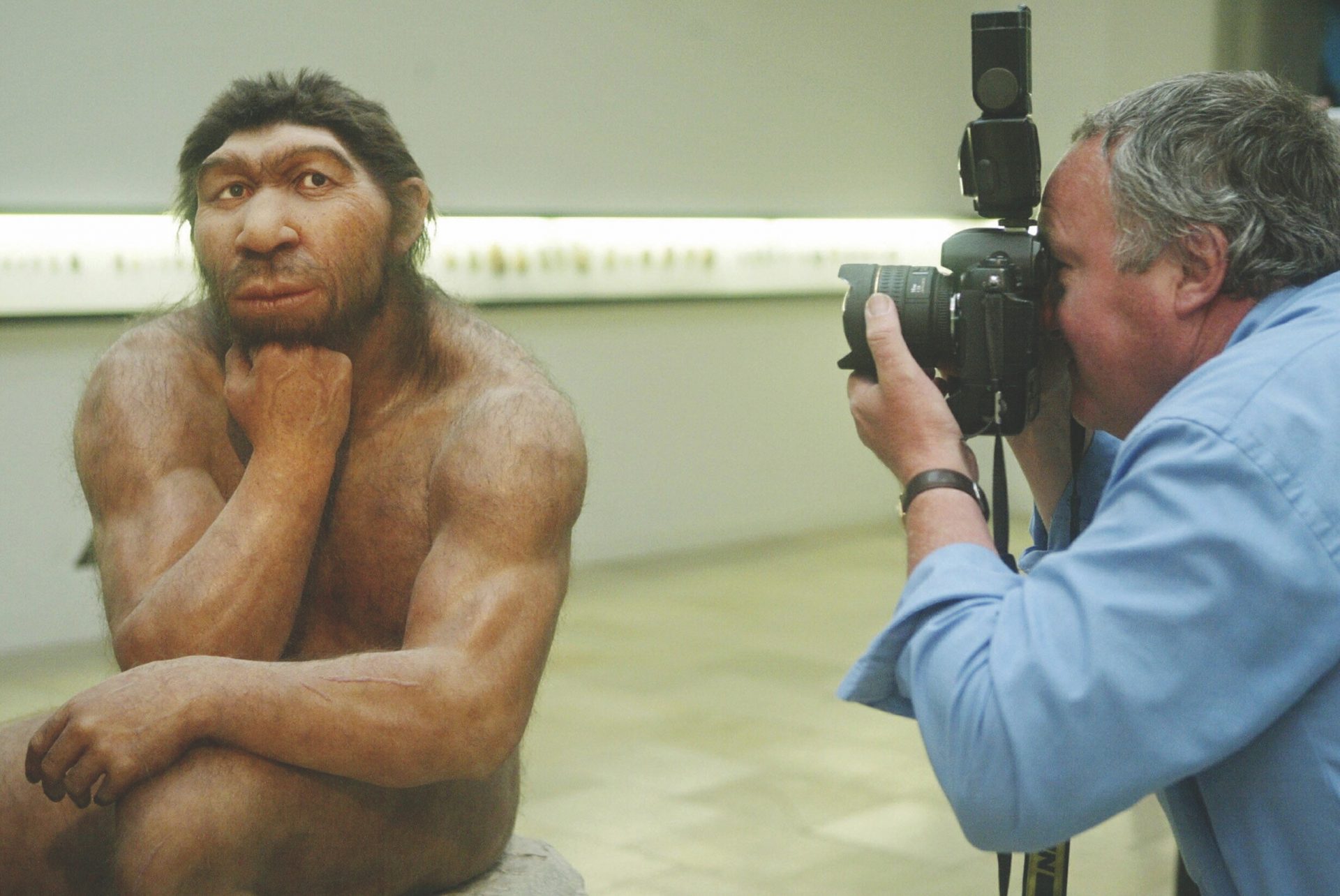 Man photographs Neanderthal figure