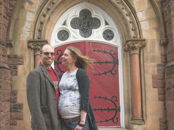 young couple in front of church entry