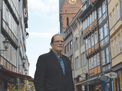 white bearded man standing on street