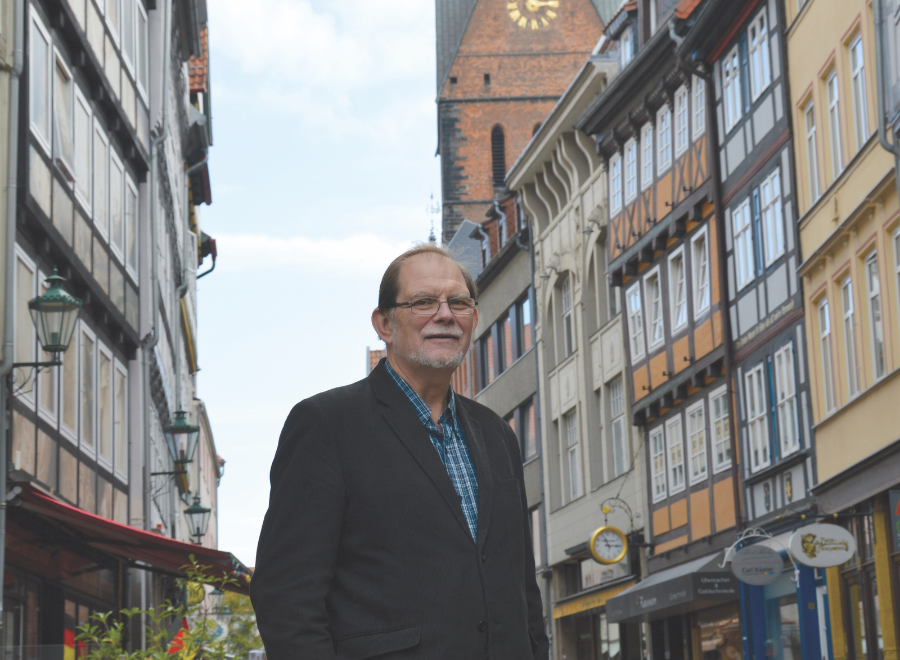 white bearded man standing on street