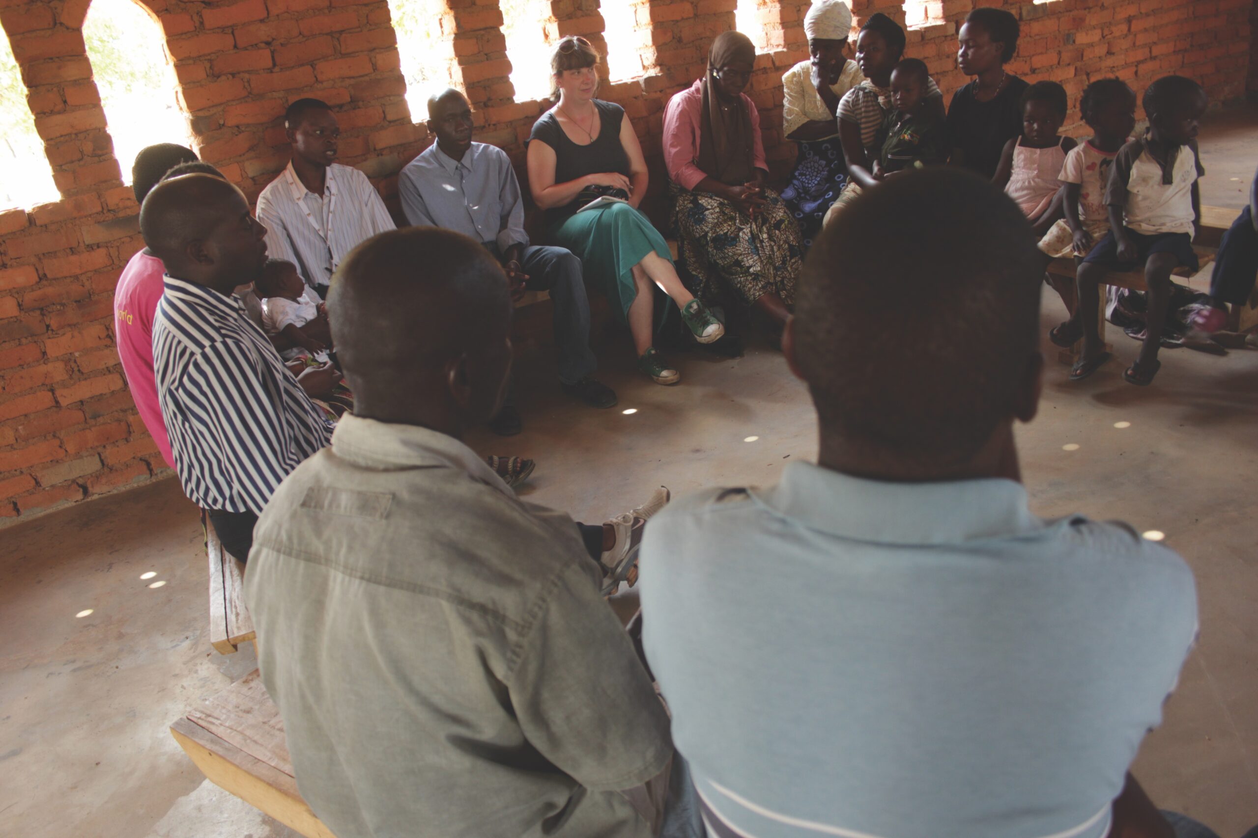 Malawians sit in circle in church