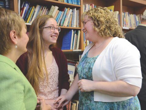 Three women in a library