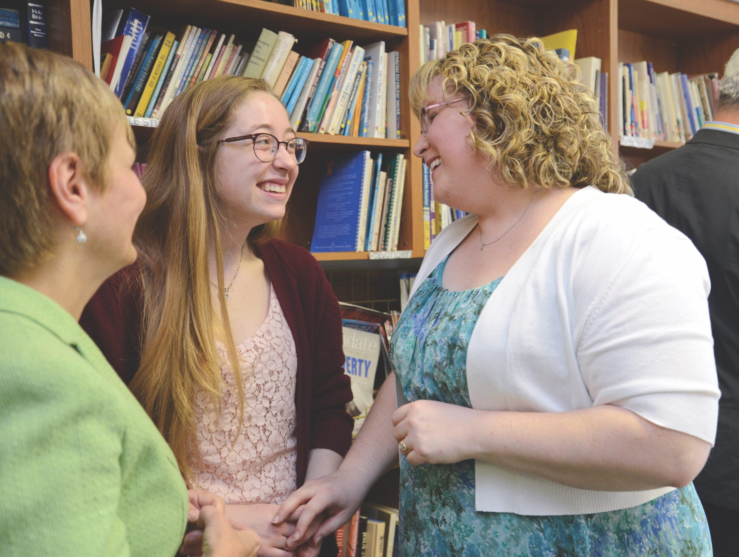 Three women in a library