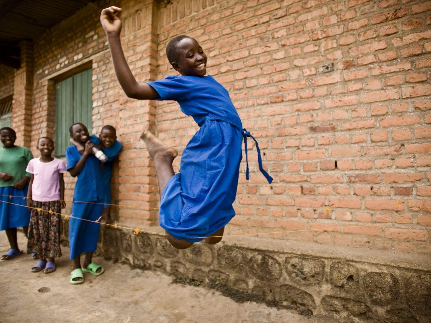 African girls playing jump rope
