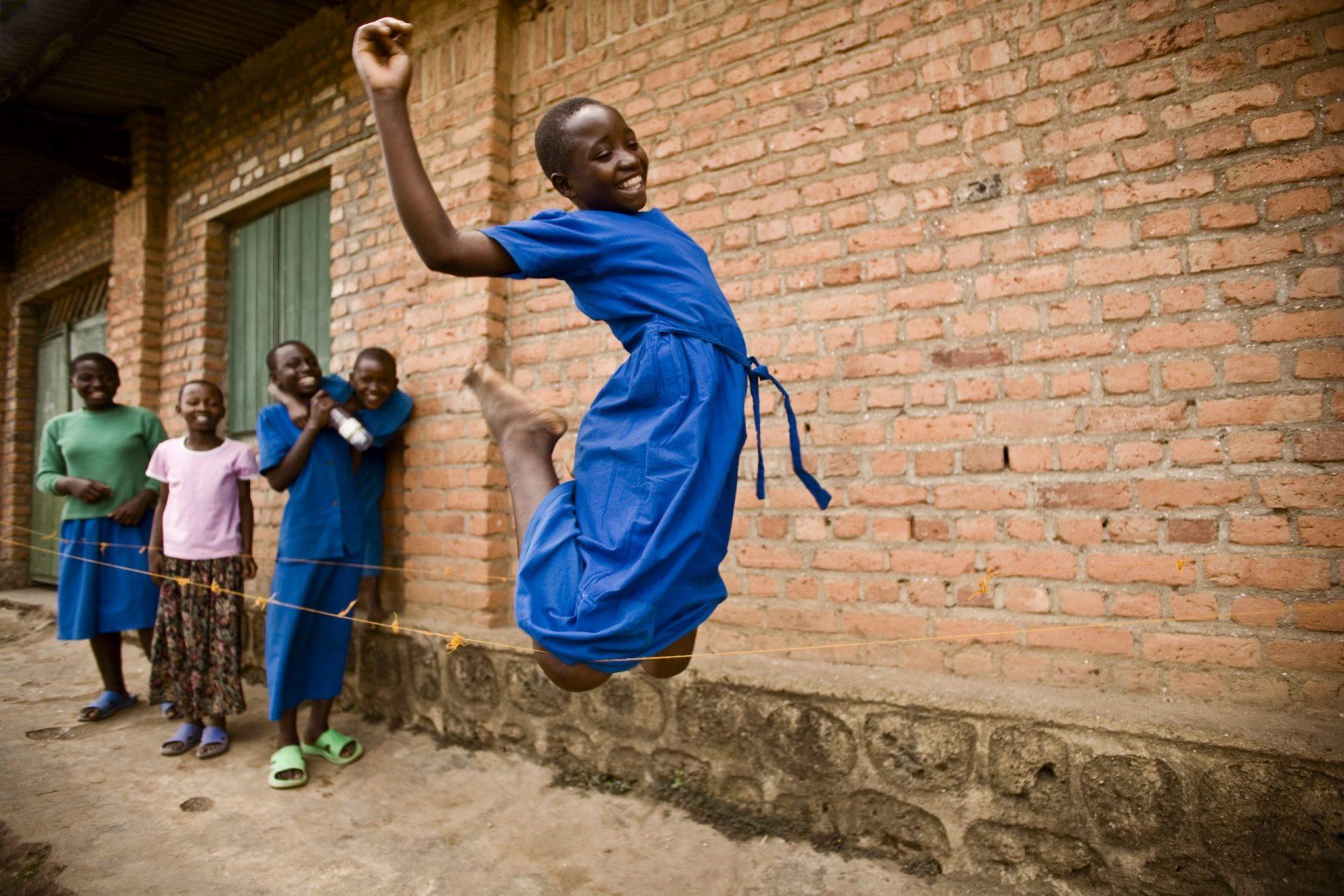 African girls playing jump rope