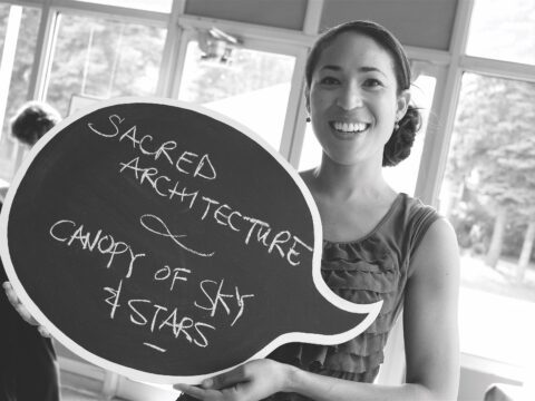 Woman holds blackboard speech bubble