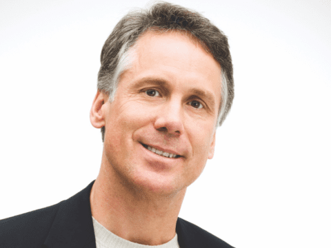 Grey-haired white man head shot