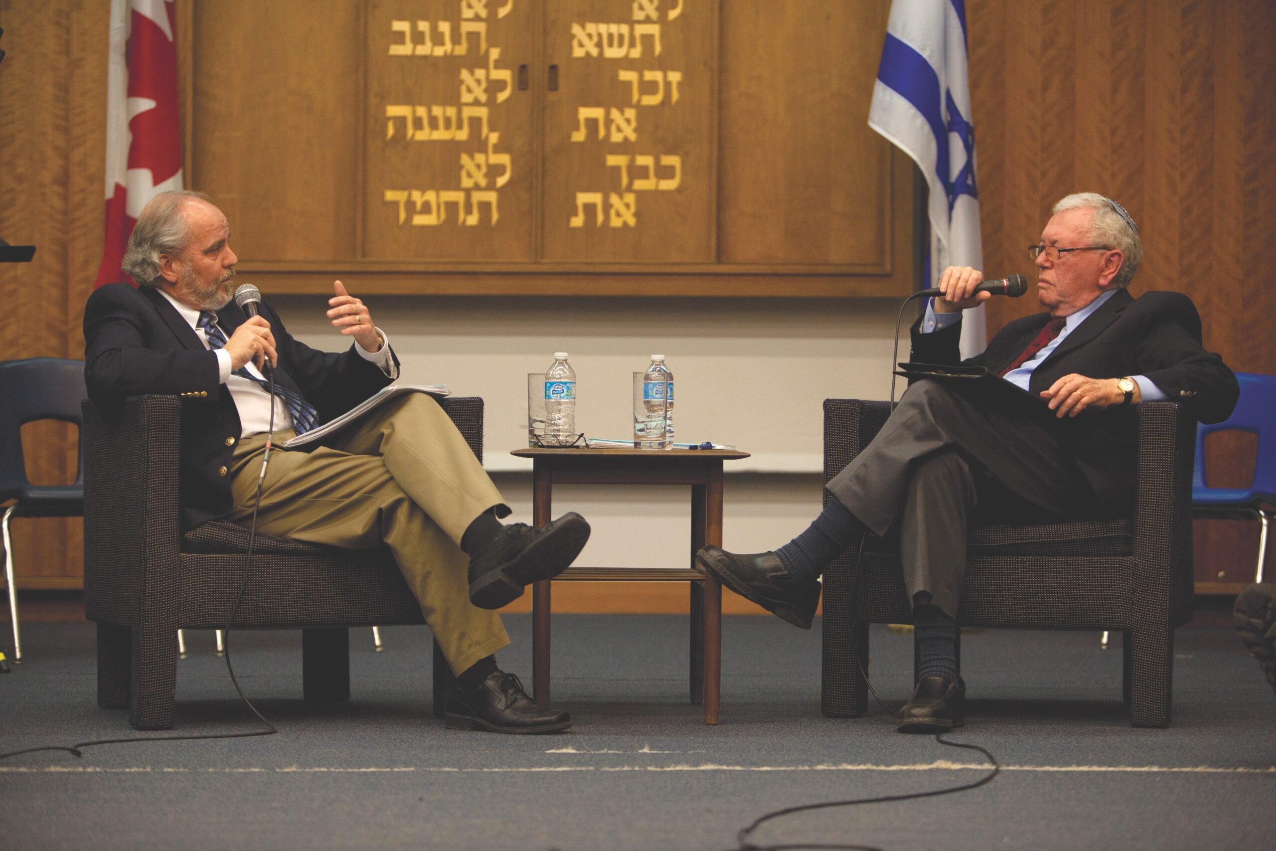 Two men in detente, sitting in chairs