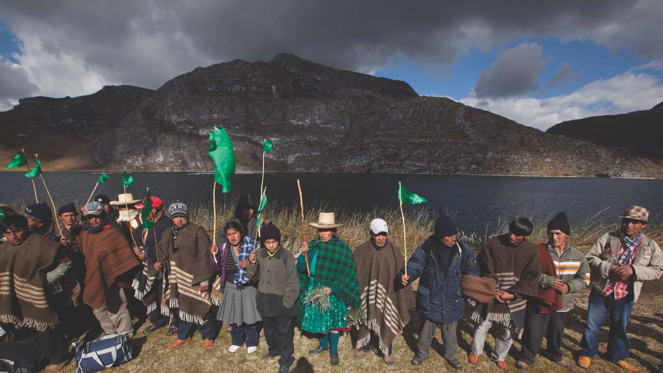 Peru villages protest in front of lake and mountain