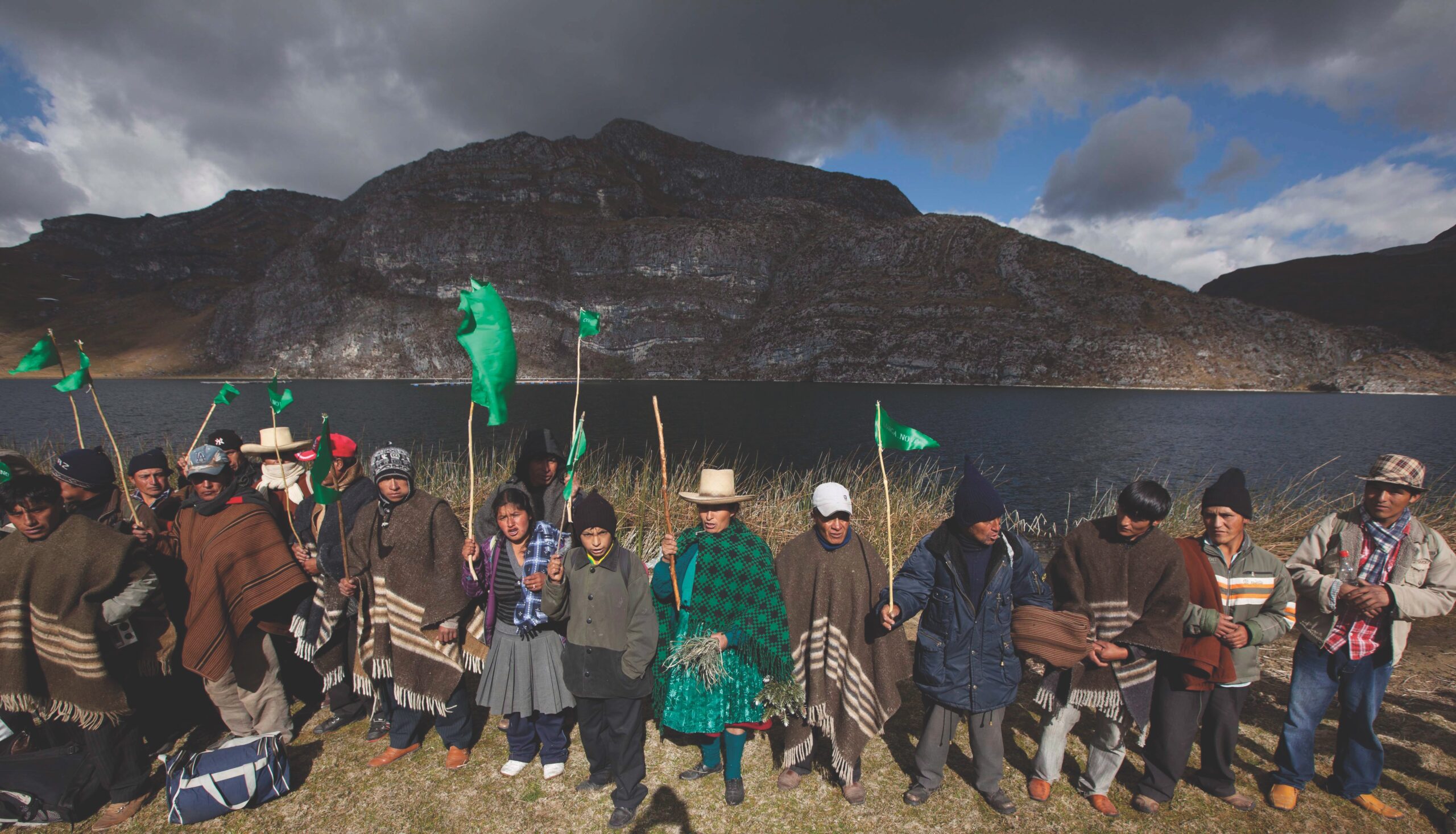 Peru villages protest in front of lake and mountain