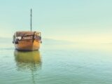 small wooden shop on calm sea
