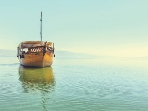 small wooden shop on calm sea