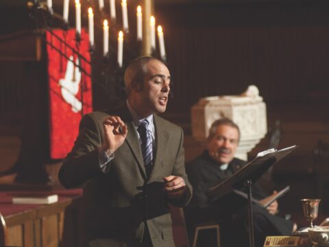 Man in suit singing