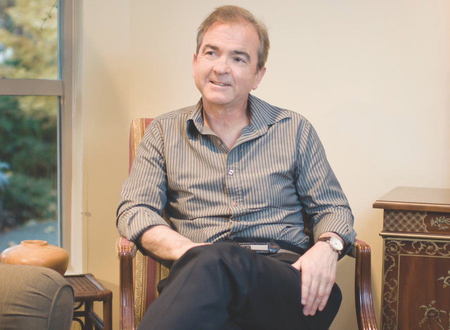 white man sitting in chair
