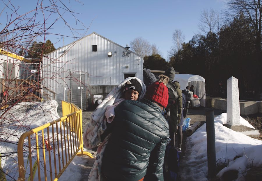 Asylum seeks cross into Canada.
