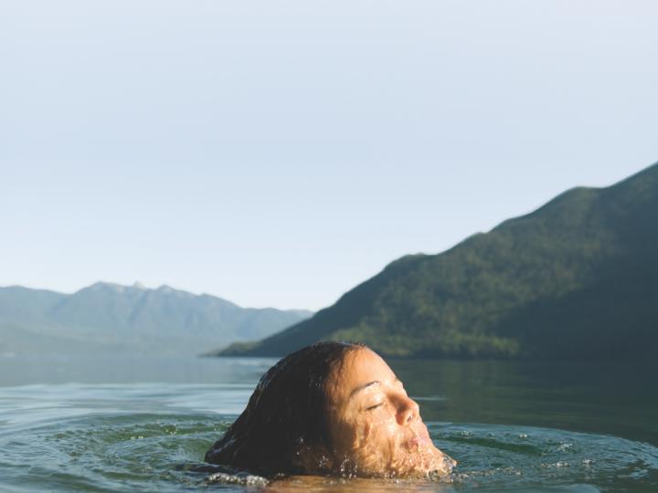 White person swimming in lake