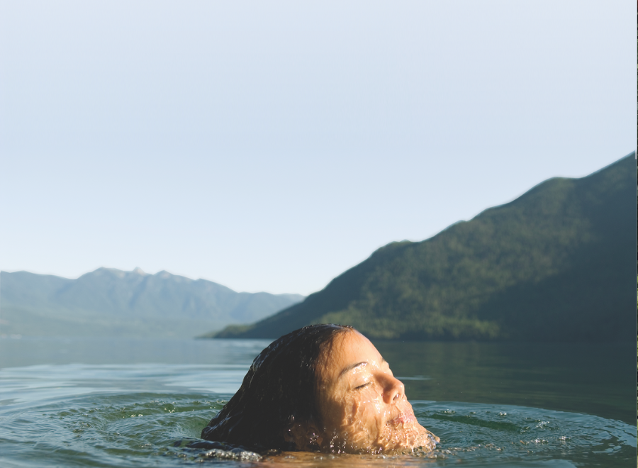 White person swimming in lake