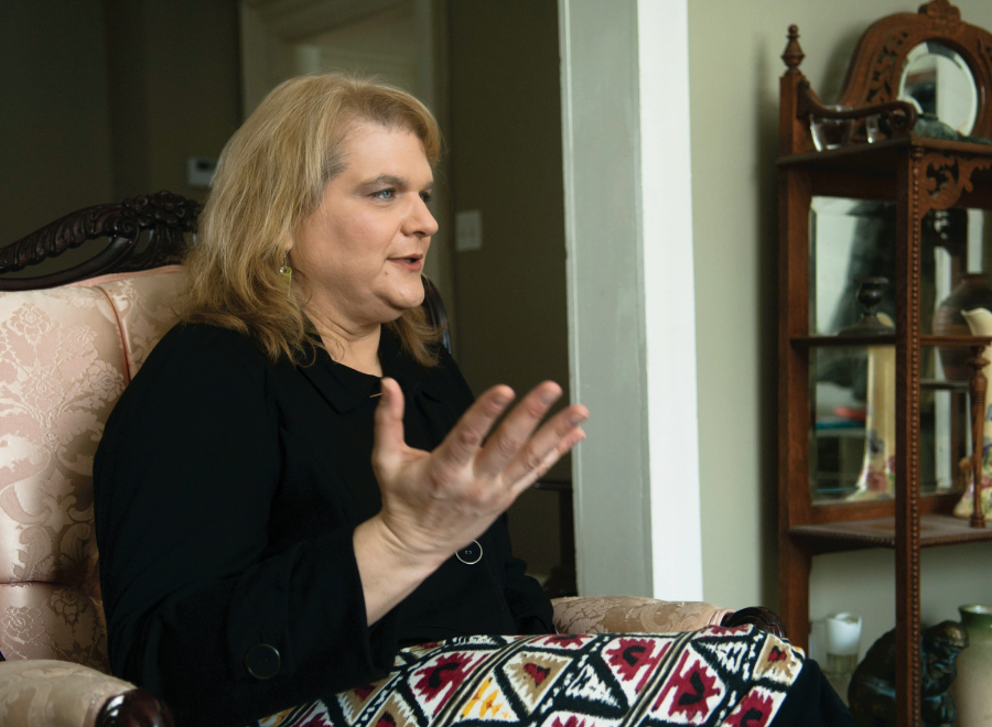 Woman sitting on chair speaking