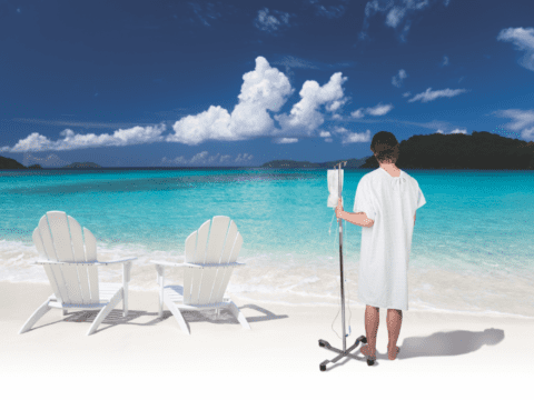 Photo illustration of patient in hospital gown on beach