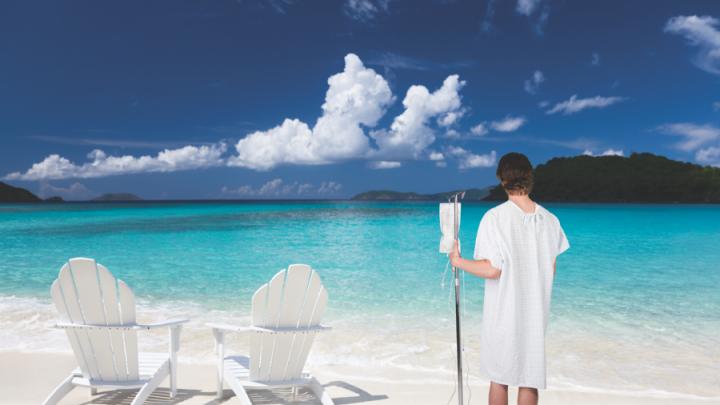 Photo illustration of patient in hospital gown on beach