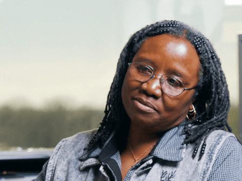 Young Black woman in blue shirt