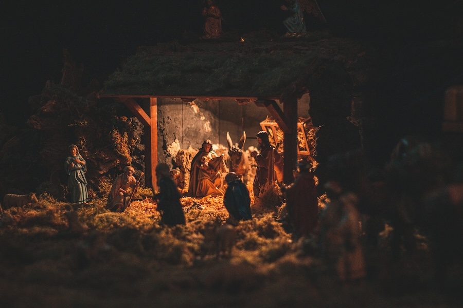 Image of a manger with Jesus, Mary and Joseph and other visitors.