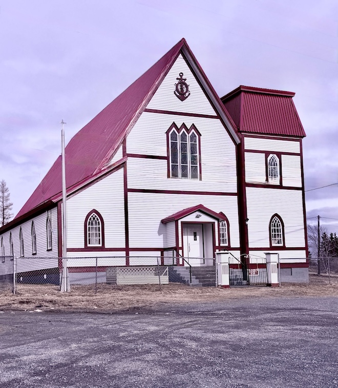 Image of a white church with a red roof