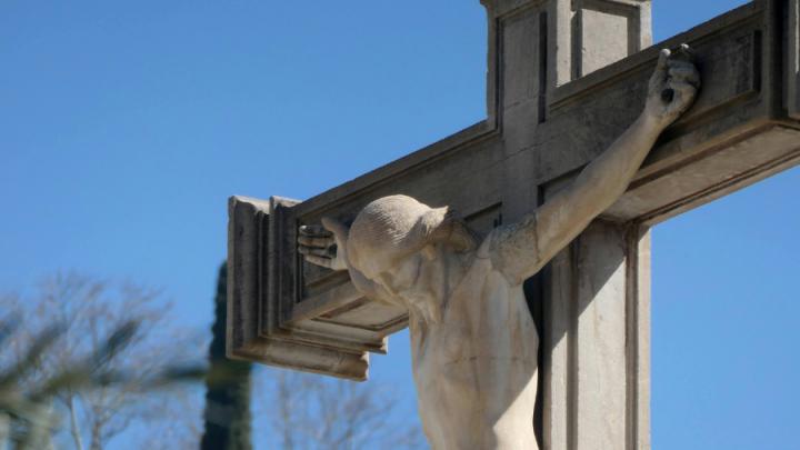 Image of Jesus on the cross against a blue sky