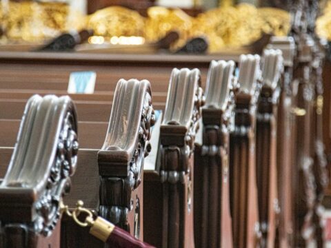 Empty church pews roped off