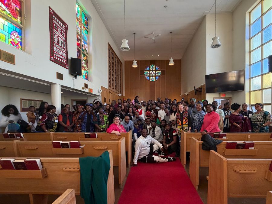 People pose for a photo at a church
